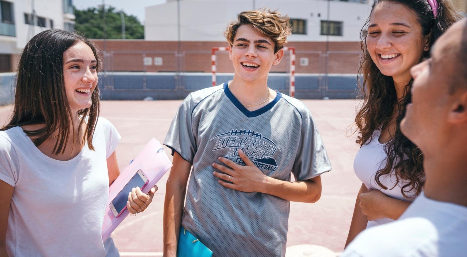 Close-up of hands working on detailed financial calculations with calculator and spreadsheet analysis