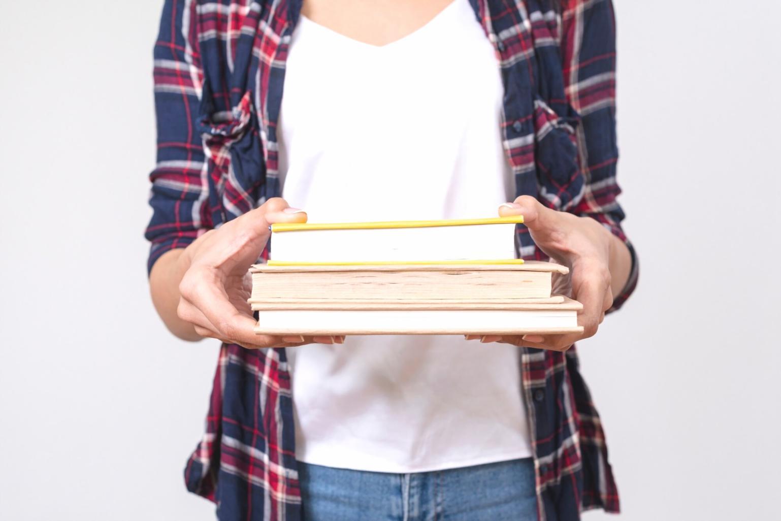 Professional presentation setup with financial charts and graphs displayed on screens for educational training session