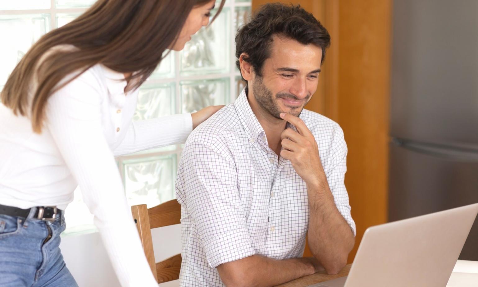 Financial analysts working together on valuation models and data analysis in a modern learning environment